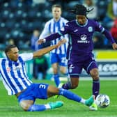 Kilmarnock's Corrie Ndaba was sent off for this challenge on Hibs' Jair Tavares in an eventful 2-2 draw.