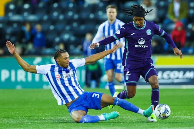 Kilmarnock's Corrie Ndaba was sent off for this challenge on Hibs' Jair Tavares in an eventful 2-2 draw.