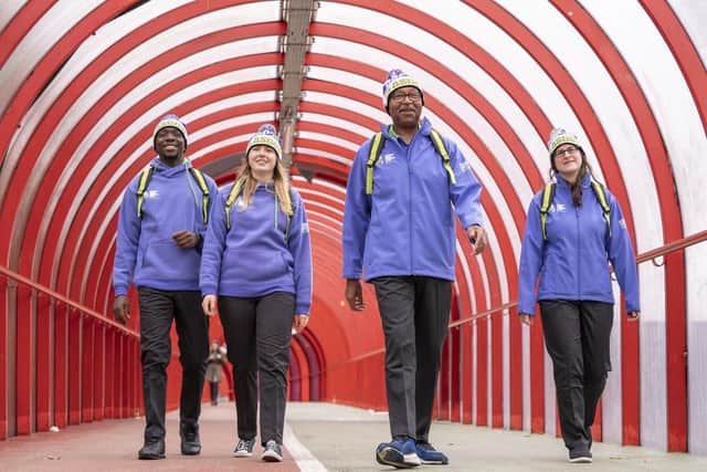 Some volunteers are trying to flog their uniforms online, but not Donald Onaiwu, Leigh Baxter, Bob Alston and Kirstin McEwan model the Cop26 volunteer uniforms (Jane Barlow/PA) / PA Wire