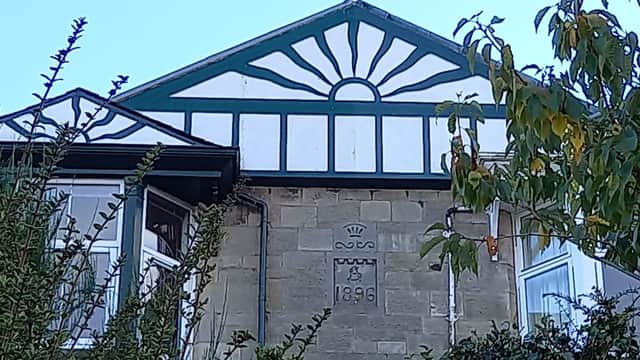 One of Stewart's houses in the village with the distinctive sun ray motif, which reflects the new age of light the builder brought to Wormit. PIC: Michael Devlin.