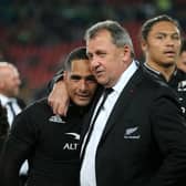 New Zealand's coach Ian Foster embraces New Zealand's scrum-half Aaron Smith as they celebrate after victory over South Africa.