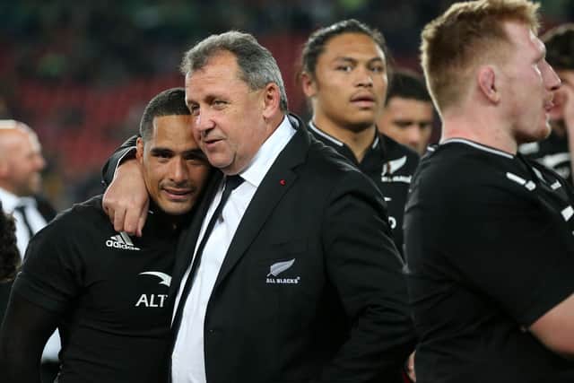 New Zealand's coach Ian Foster embraces New Zealand's scrum-half Aaron Smith as they celebrate after victory over South Africa.