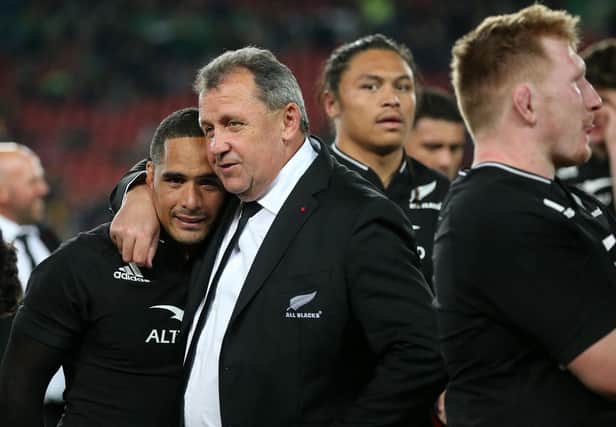 New Zealand's coach Ian Foster embraces New Zealand's scrum-half Aaron Smith as they celebrate after victory over South Africa.
