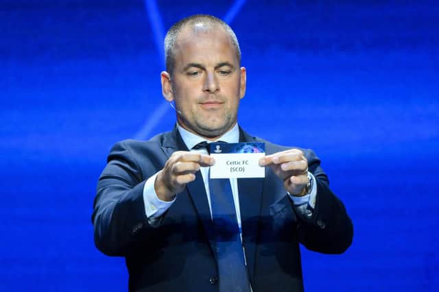 English former football player Joe Cole shows the paper slip of Celtic FC during the draw for the 2023/2024 UEFA Champions League at The Grimaldi Forum in the Principality of Monaco.
