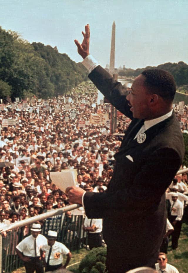 The Rev Martin Luther King Jr acknowledges the crowd at the Lincoln Memorial in Washington DC for his 'I Have a Dream' speech on August 28, 1963 (Picture: AP)