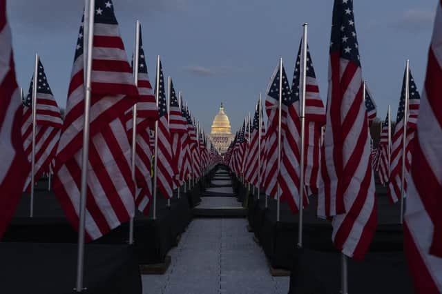 US flags have been placed on the National Mall, with the US Capitol behind them, ahead of the inauguration of President-elect Joe Biden and Vice President-elect Kamala Harris (Picture: Alex Brandon/AP)