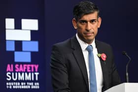 Prime Minister Rishi Sunak listens to a question as he holds the closing press conference at the AI safety summit.