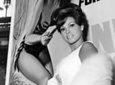 Raquel Welch pictured in London in 1965 in front of a poster  promoting One Million Years BC