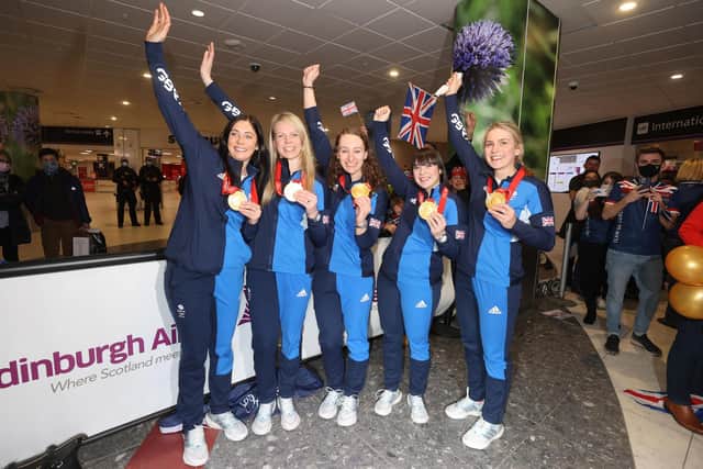Great Britain curling Gold medalists Eve Muirhead, Vicky Wright, Jennifer Dodds, Hailey Duff and Mili Smith arrive at Edinburgh Airport. (Photo credit: Steve Welsh/PA Wire).