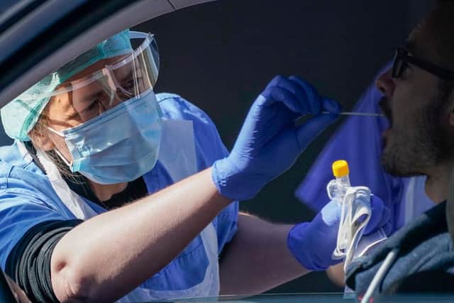 NHS workers are tested for Covid-19 at a drive through testing site. (Photo by Christopher Furlong/Getty Images)