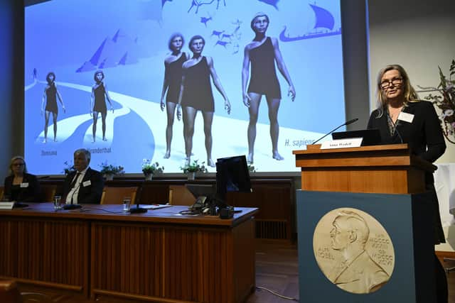 Chair of the Nobel Committee for Physiology or Medicine Anna Wedell, left, presents the discovery made by Swedish scientist Svante Paabo, winner of the 2022 Nobel Prize in Physiology or Medicine, during a press conference at the Karolinska Institute in Stockholm, Sweden, on Monday, Oct. 3, 2022. (Henrik Montgomery/TT News Agency via AP)