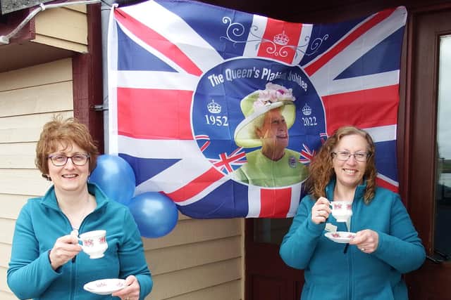 Valerie Johnson and assistant Shelley Howden have a cup of tea after their efforts to honour the Queen