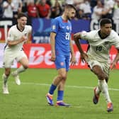 Jude Bellingham celebrates scoring England's injury-time equaliser against Slovakia at Euro 2024. (Photo by ADRIAN DENNIS/AFP via Getty Images)