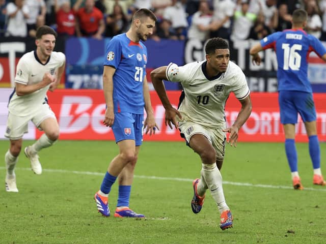 Jude Bellingham celebrates scoring England's injury-time equaliser against Slovakia at Euro 2024. (Photo by ADRIAN DENNIS/AFP via Getty Images)