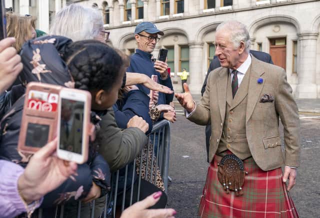 King Charles III meets the crowds on Union Street during a visit to Aberdeen Town House to meet families who have settled in Aberdeen from Afghanistan, Syria and Ukraine. Picture date: Monday October 17, 2022.