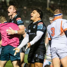 Glasgow Warriors' Stafford McDowall (L) and Sione Tuipulotu celebrate Johnny Matthews try during the win over Edinburgh.