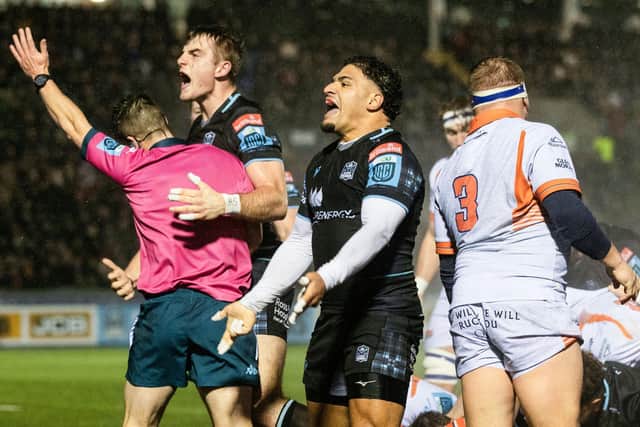 Glasgow Warriors' Stafford McDowall (L) and Sione Tuipulotu celebrate Johnny Matthews try during the win over Edinburgh.
