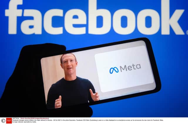 Facebook CEO Mark Zuckerberg is seen on a video displayed on a smartphone screen as he announces the new name for Facebook. Photograph:Pavlo Gonchar/SOPA Images/Shutterstock