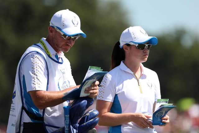 Leona Maguire talks tactics with her caddie during the last-day singles. Picture: Maddie Meyer/Getty Images.