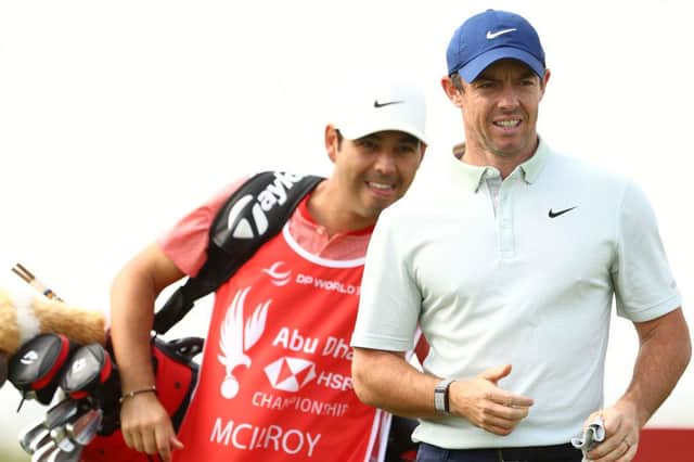 Rory McIlroy walks ahead of caddie Harry Diamond during a practice round prior to the Abu Dhabi HSBC Championship at Yas Links. Picture: Francois Nel/Getty Images.