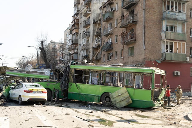 A destroyed trolley bus, hit by pieces of a Russian missile intercepted by Ukrainian air defences over Kyiv. The trolley was being used as a stationary barricade to impede enemy troop movements, it was empty. However, one bystander was nonetheless killed.  

Photojournalist Bennett Murray captured scenes on March 14 in Obolon district, Kyiv, Ukraine.