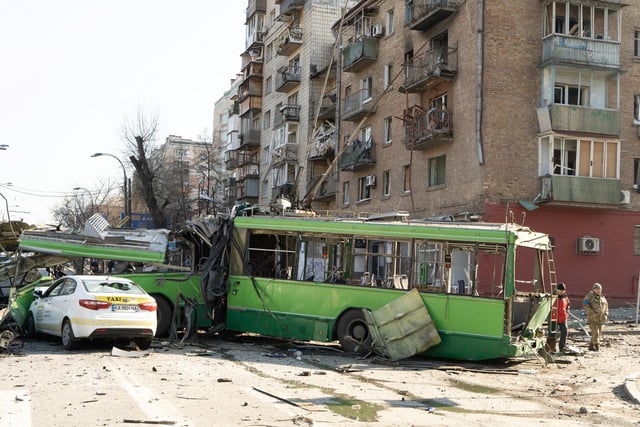 A destroyed trolley bus, hit by pieces of a Russian missile intercepted by Ukrainian air defences over Kyiv. The trolley was being used as a stationary barricade to impede enemy troop movements, it was empty. However, one bystander was nonetheless killed.
Photojournalist Bennett Murray captured scenes on March 14 in Obolon district, Kyiv, Ukraine.