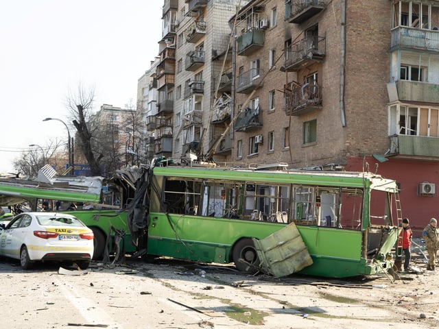 A destroyed trolley bus, hit by pieces of a Russian missile intercepted by Ukrainian air defences over Kyiv. The trolley was being used as a stationary barricade to impede enemy troop movements, it was empty. However, one bystander was nonetheless killed.  

Photojournalist Bennett Murray captured scenes on March 14 in Obolon district, Kyiv, Ukraine.