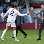 Matty Cash of Aston Villa shakes hands with Unai Emery after the win over Burnley.