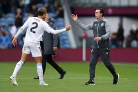 Matty Cash of Aston Villa shakes hands with Unai Emery after the win over Burnley.