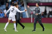 Matty Cash of Aston Villa shakes hands with Unai Emery after the win over Burnley.