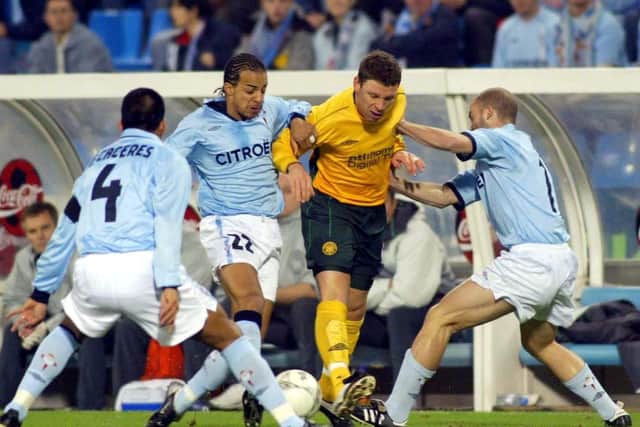 Celta Vigo's Peter Luccin (second left) fights for the ball alongside Celtic's Alan Thompson during a UEFA Cup tie in 2002.