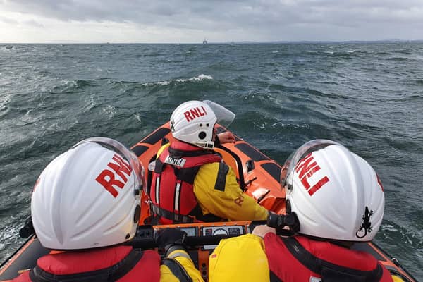 Emergency services respond after woman falls and suffers suspected broken ankle on Fife coast.