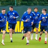 The Scotland squad train ahead of flying out to Copenhagen to face Denmark in the latest World Cup qualifier. (Photo by Ross MacDonald / SNS Group)