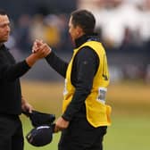 Xander Schauffele celebrates with his caddie Austin Kaiser on the 18th green after winnin the 152nd Open at Royal Troon. Picture: Andrew Redington/Getty Images.