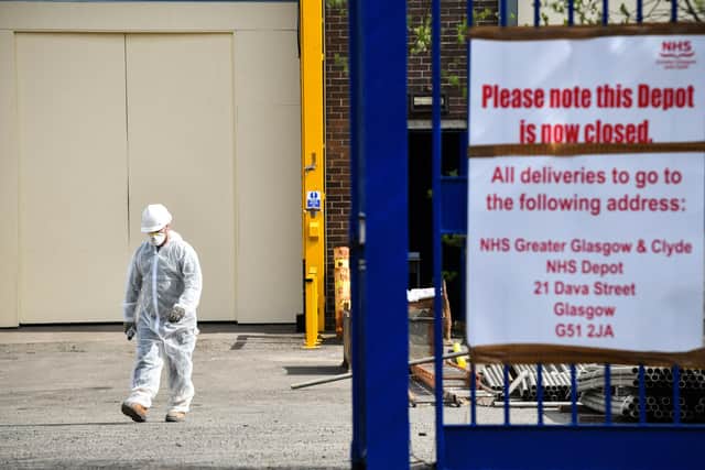 Workmen are seen at a warehouse on an industrial estate in Glasgow which is currently being converted into a body storage facility to accommodate up to 1,700 bodies during the Coronavirus crisis
