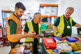 Volunteers pack emergency food parcels