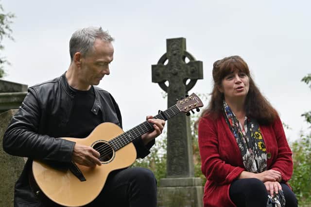 Singer Mary Ann Kennedy and guitarist Finlay Wells perform at the grave of Victorian Gaelic opera singer, Jessie McLachlan.