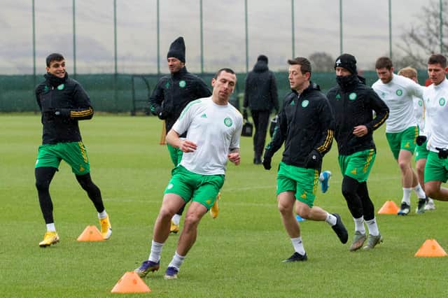 Mohamed Elynounoussi and Scott Brown lead the way at training at Lennoxtown