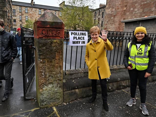 Nicola Sturgeon and candidate Roza Salih outside the polling station at the Annette Street school in Govanhill, Glasgow