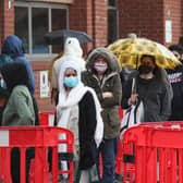 People queuing in the car park for a vaccination at the Glasgow Central Mosque in Glasgow. Glasgow and Moray remain in level three restrictions despite the rest of mainland Scotland moving to level two on Monday. Picture: PA
