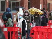 People queuing in the car park for a vaccination at the Glasgow Central Mosque in Glasgow. Glasgow and Moray remain in level three restrictions despite the rest of mainland Scotland moving to level two on Monday. Picture: PA