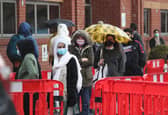 People queuing in the car park for a vaccination at the Glasgow Central Mosque in Glasgow. Glasgow and Moray remain in level three restrictions despite the rest of mainland Scotland moving to level two on Monday. Picture: PA
