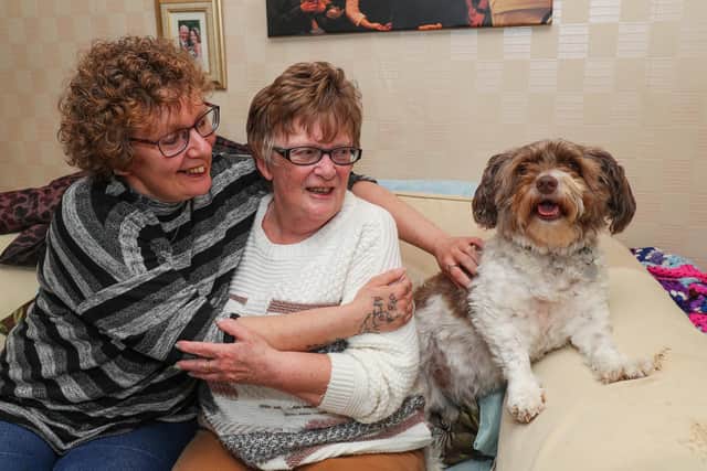 Lisa Wadey hugs her mum Angela and Angela's dog Alfie for the first time since lockdown restrictions were relaxed. Picture: Stuart Martin