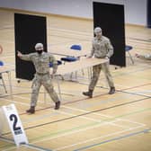 Members of the Royal Scots Dragoon Guard carry out a reconnaissance before setting up a Covid–19 vaccination centre at the Ravenscraig Regional Sports Facility in Motherwell, Lanarkhire. Picture date: Monday January 18, 2021. PA Photo. See PA story SCOTLAND Coronavirus Vaccine.  Jane Barlow/PA Wire