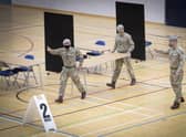 Members of the Royal Scots Dragoon Guard carry out a reconnaissance before setting up a Covid–19 vaccination centre at the Ravenscraig Regional Sports Facility in Motherwell, Lanarkhire. Picture date: Monday January 18, 2021. PA Photo. See PA story SCOTLAND Coronavirus Vaccine.  Jane Barlow/PA Wire