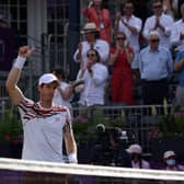 Andy Murray celebrates winning against France's Benoit Paire during the first round at Queen's Club.