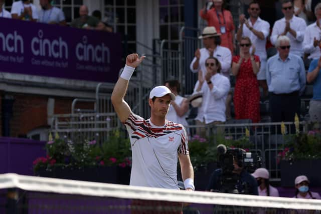Andy Murray celebrates winning against France's Benoit Paire during the first round at Queen's Club.