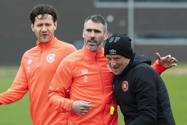 Michael Smith, centre, is back in Hearts training.