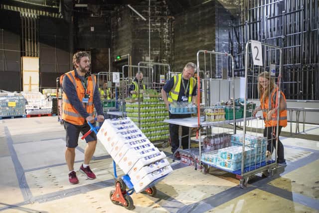More than 1000 food parcels were packed on stage at Eden Court before being distributed across the Highlands by volunteers to people who were shielding. Picture: Jane Barlow