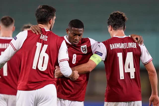 David Alaba, centre, and Julian Baumgartlinger are two of Austria's German-based players who may miss the trip to Scotland